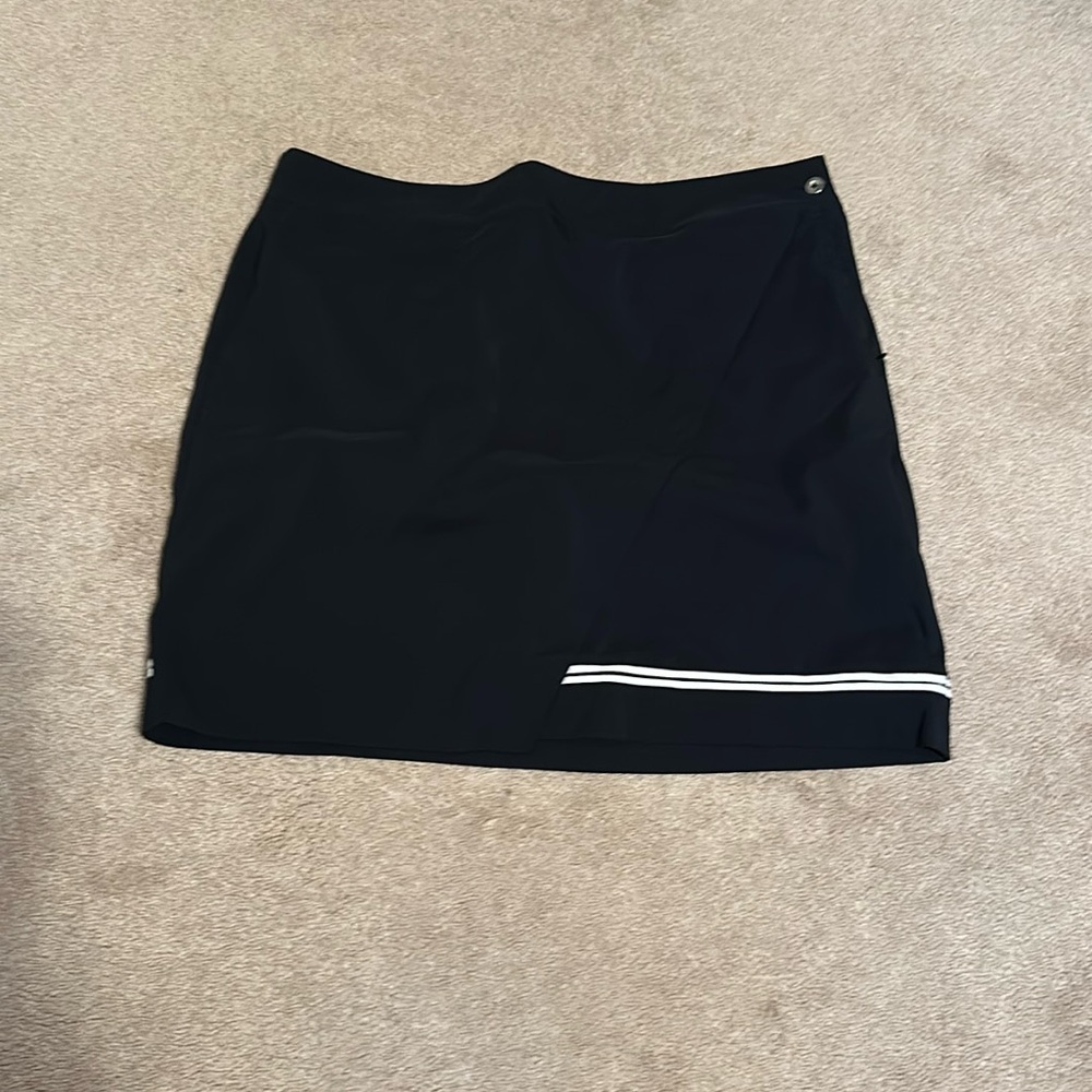 EP golf skort. Size 14. Navy blue with white stripe.